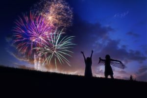 fireworks in sky with girls silhouette