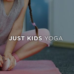 A Child Stretches at a Yoga Studio