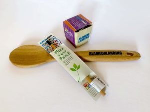 A Wooden Spoon, Pencil, and Seeds that are designed as leave behinds after a new community Grand Opening