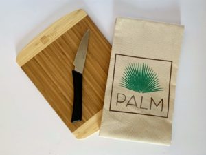 A cutting board and towel giveaways