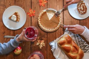 thanksgiving meal table with pumpkin pie